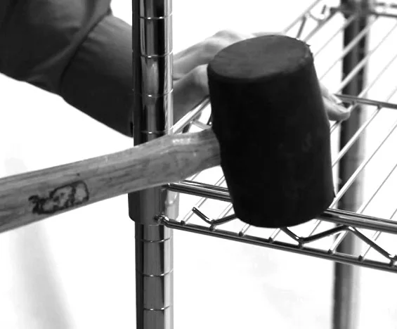 Rubber mallet seating an Ultra Power wire shelf on its post