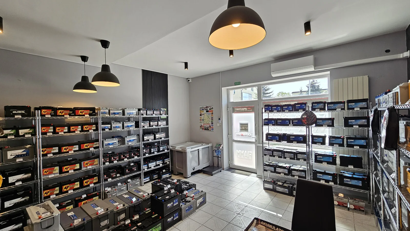 Automotive retail stock arranged on modular Chrome wire shelving