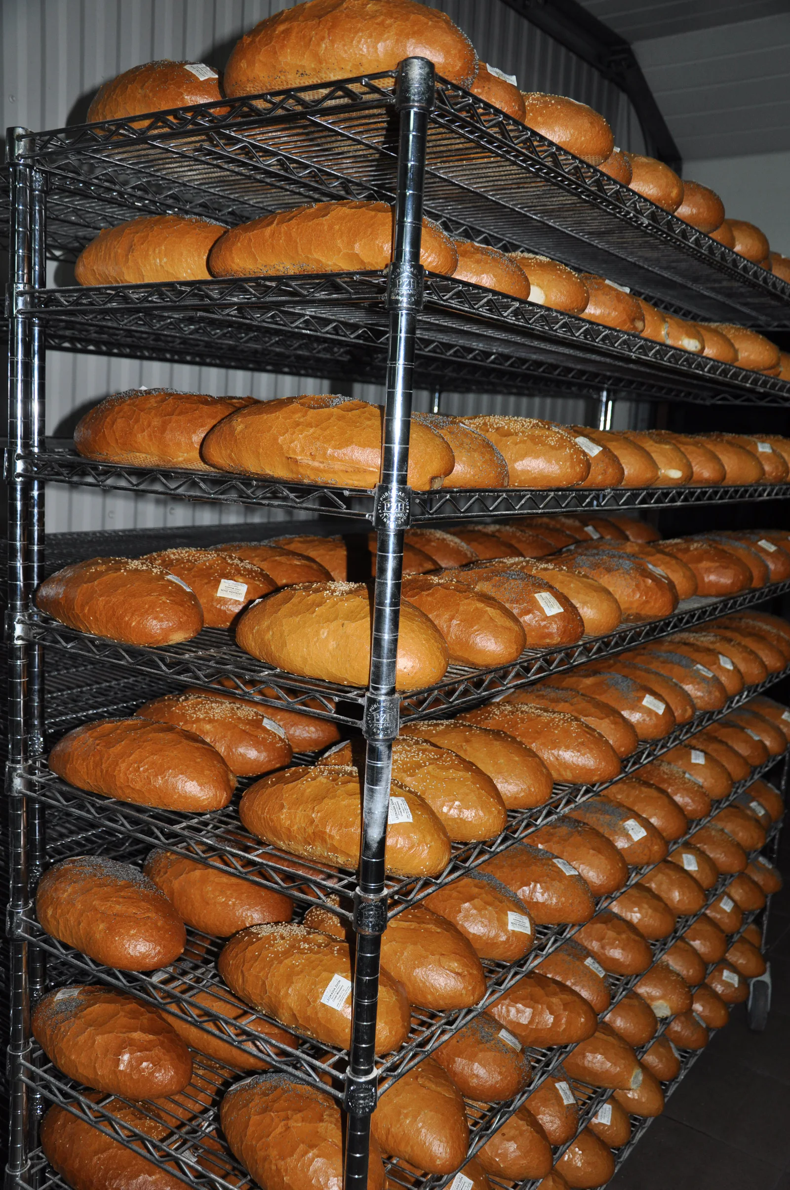 WP bakery cart with open wire shelves carrying bread